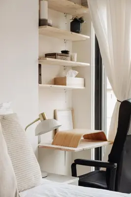 a bedroom with a desk and a chair next to a window at Luxurious Private Studio Amsterdam Zuid in Amsterdam