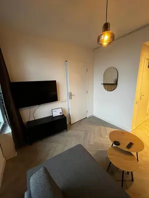 a living room with a couch and a table at ‘T Singeltje in Leiden