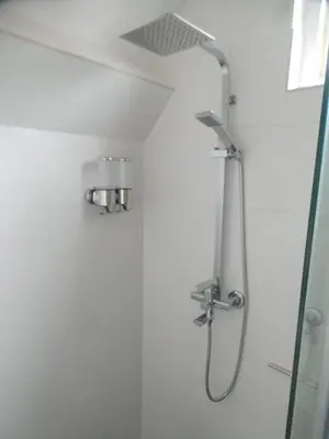 a shower in a bathroom with a glass door at Top appartement in prachtige hart van Nederland Kortenhoef in Kortenhoef
