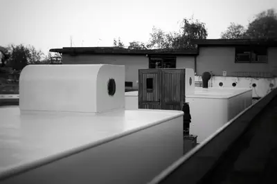 a white appliance on the roof of a building at Houseboat-Amsterdam-Classic in Amsterdam