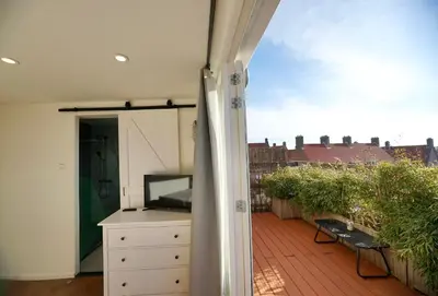 a balcony with a view of a building at Windhoek Apartment in Zandvoort