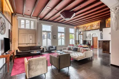 a living room with couches and chairs at Edam Suites in Edam