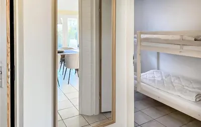 a mirror in a room with a bunk bed at 3 Bedroom Stunning Home In Dirkshorn in Dirkshorn