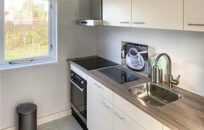 a small kitchen with a sink and a window at 3 Bedroom Stunning Home In Dirkshorn in Dirkshorn