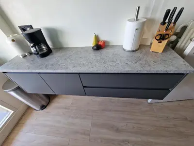 a kitchen counter with a gray counter top at Beach & Sea view in Zandvoort