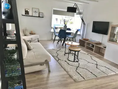 a living room with a couch and a table at Quiet Waterloft near Amsterdam and Schiphol WS17 in Aalsmeer