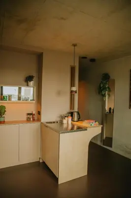 a kitchen with a sink and a counter top at Hotel Jansen Amsterdam Bajeskwartier in Amsterdam