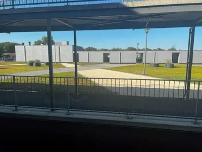 a view of a parking lot from the inside of a building at center appartement 2 rooms in Alphen aan den Rijn