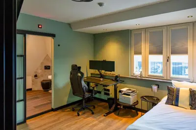 an office with a desk and a computer in a room at Villa Savannah in Roelofarendsveen