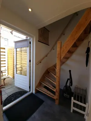 a room with stairs leading to the attic at ZeeZuid in Egmond aan Zee