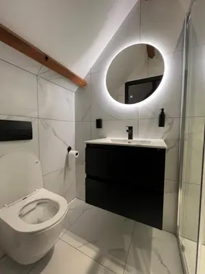 a bathroom with a toilet and a sink and a mirror at Boutique Hotel de Kade Zaandam-Amsterdam in Zaandam