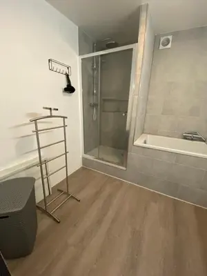 a bathroom with a shower and a bath tub at By Balu in Soest