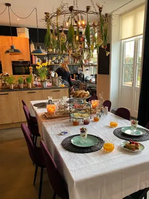 a table with food on it in a kitchen at Bed and Breakfast Geliefd in Voorhout