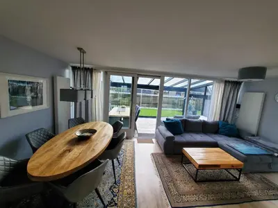 a living room with a table and a couch at villachiller in Sint Maarten