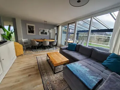 a living room with a couch and a table at villachiller in Sint Maarten