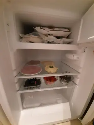 an open refrigerator filled with lots of food at B&B Hendricus in Hoofddorp
