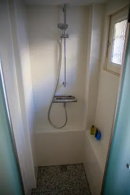 a bathroom with a shower with a shower curtain at Obrecht Welcome in Utrecht