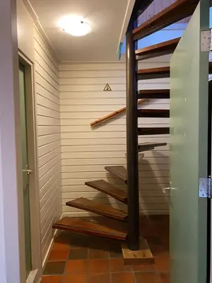 a set of stairs in a room with a wall at Het Kraaienest in Zaandam