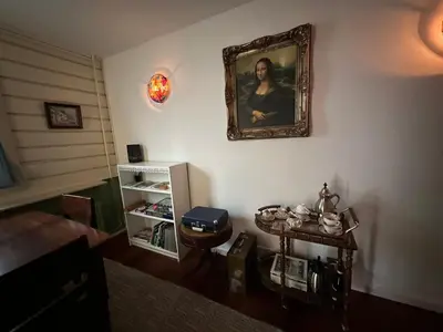 a room with a picture of a woman on the wall at Het Kraaienest in Zaandam