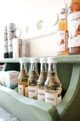 a shelf with several bottles of sauce in a refrigerator at Boutique B&B Dolce Due in Assendelft
