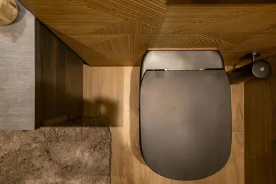 a door in a room with a wooden ceiling at Luxe Studio Liemers in Lelystad