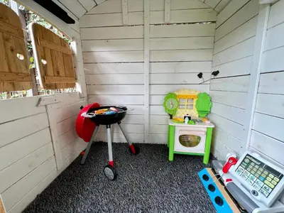 a small room with a grill and a stove at NEW - Private Cabin - on a lake near Amsterdam in Vinkeveen