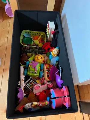 a black box filled with toys on the floor at NEW - Private Cabin - on a lake near Amsterdam in Vinkeveen
