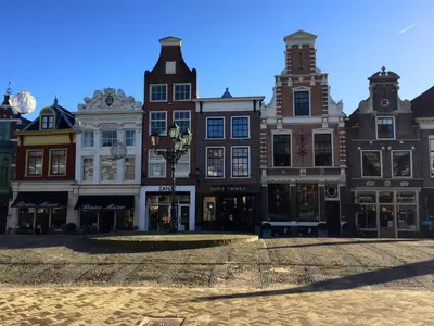 a group of buildings on a city street at Vakantiehuis Achter de Duinen in Castricum