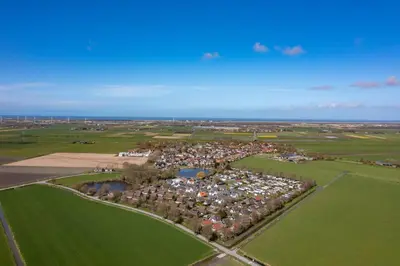 an aerial view of a large group of houses in a field at Meertje Villa 81 op Recreatiepark De Wielen in Sint Maarten