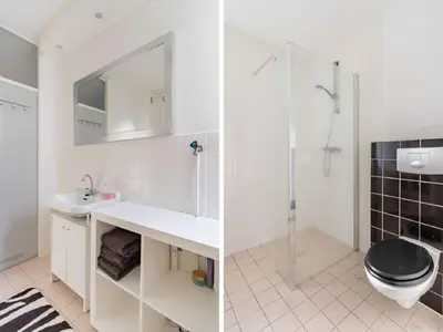 a bathroom with a toilet and a sink and a shower at Apartment in Alkmaar with sea beach in Alkmaar