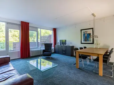 a living room with a couch and a table at Apartment in Alkmaar with sea beach in Alkmaar