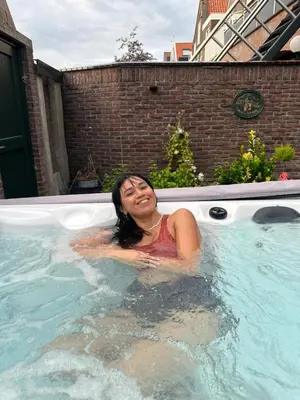 a woman in a jacuzzi in a swimming pool at B en B Volendam in Volendam