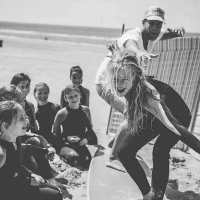 a group of people sitting on the beach at Have a nice stay! -The Birdhouse, Tiny home close to the beach in Noordwijk aan Zee