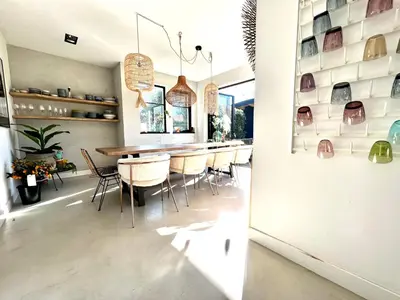 a dining room with a table and chairs at Villa Boho Beach in Bergen