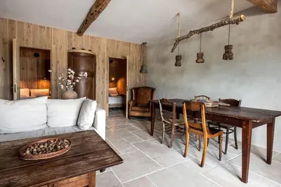 a living room with a table and a couch at The Meetinn in Waverveen