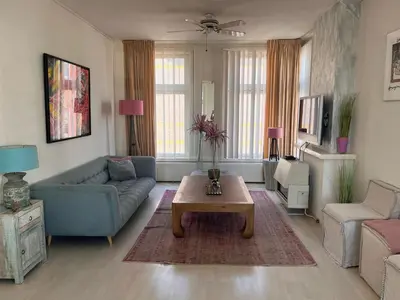 a living room with a couch and a coffee table at Zandvoort Zenith - Beautiful Apartment in Zandvoort
