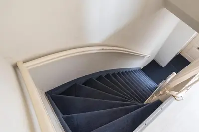 an overhead view of a spiral staircase in a building at Zandvoort Zenith - Beautiful Apartment in Zandvoort