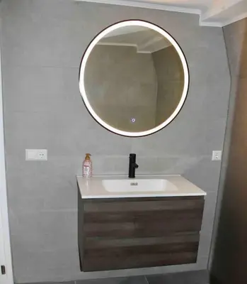 a bathroom with a sink and a mirror on the wall at Apartment City Center Gouda in Gouda