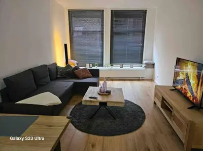 a living room with a couch and a coffee table at Apartment City Center Gouda in Gouda