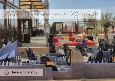 a group of chairs sitting in front of a patio at Have a nice stay! - Zomerhuis Toda Cambia dicht bij strand in Noordwijk aan Zee