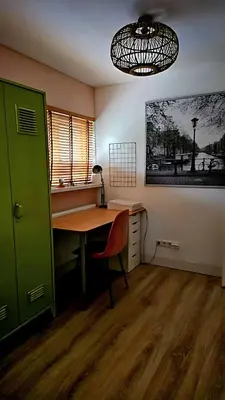 an office with a desk and a green door at Villa in the forest of Amsterdam with Pool in Velsen-Zuid