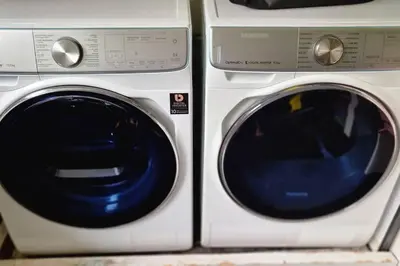 two white washing machines sitting next to each other at Villa in the forest of Amsterdam with Pool in Velsen-Zuid
