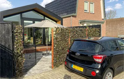 a small car parked in front of a house at Stunning House In Spakenburg in Spakenburg