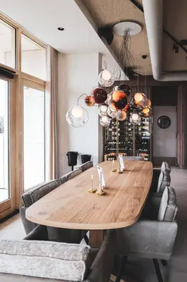 a dining room with a wooden table and chairs at Boutique Hotel Blendin Bloemendaal aan Zee in Bloemendaal Aan Zee