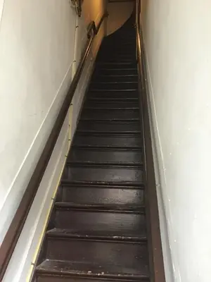 an empty stairwell in a building at Frank’s and Chong’s excellent location in Amsterdam