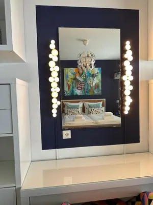 a mirror on a wall in a room at Apartment Fleurette in Zandvoort