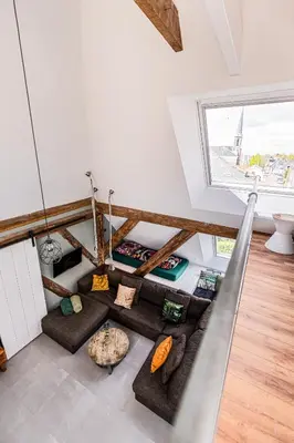 a living room with a hammock in a house at Authentic apartment in farmhouse near Amsterdam in Ilpendam