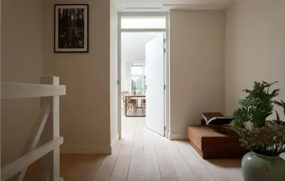 a hallway with a door leading to a dining room at Villa By The Sea in Bergen aan Zee