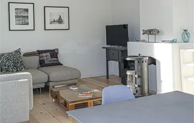 a living room with a couch and a table at Nautilus 1 in Bergen aan Zee