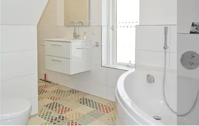 a bathroom with a tub and a toilet and a sink at Nautilus 1 in Bergen aan Zee